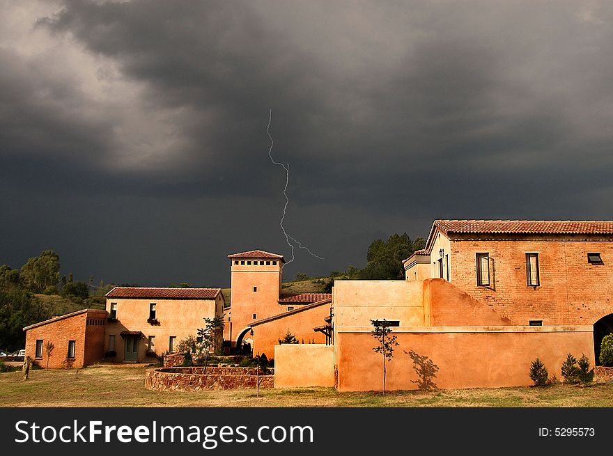 Village  sunset  blue thunderstorm clouds  lightning. Village  sunset  blue thunderstorm clouds  lightning