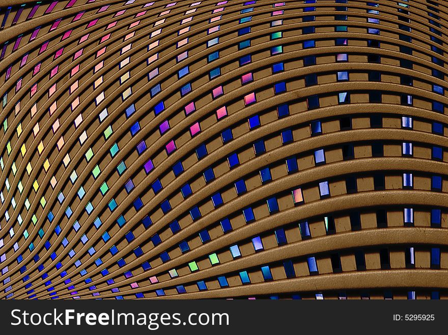 Warped Abstract grid with random colours visible behind the grid. Could be used as a background. Warped Abstract grid with random colours visible behind the grid. Could be used as a background.
