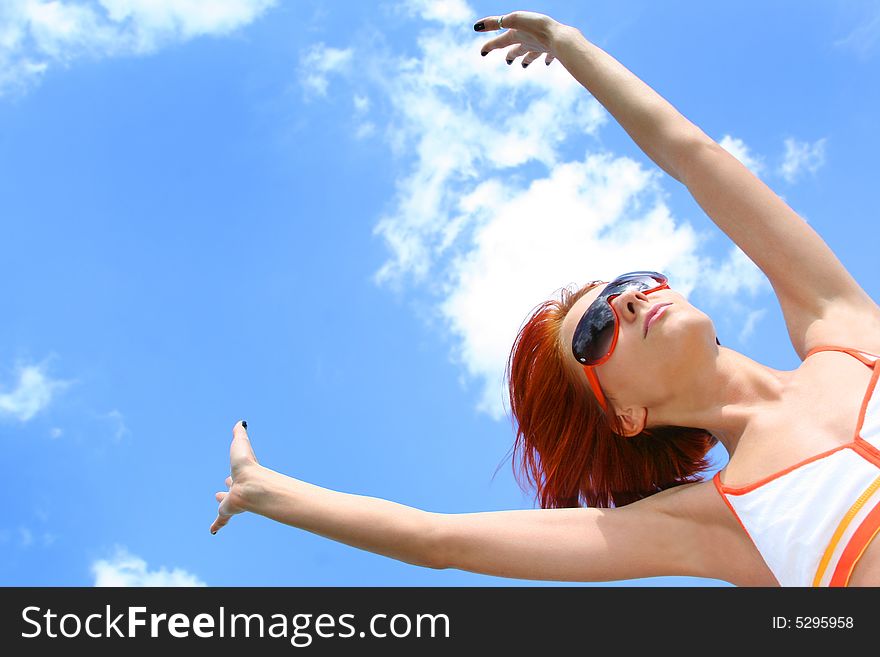 Young redhead girl and blue sky. Young redhead girl and blue sky