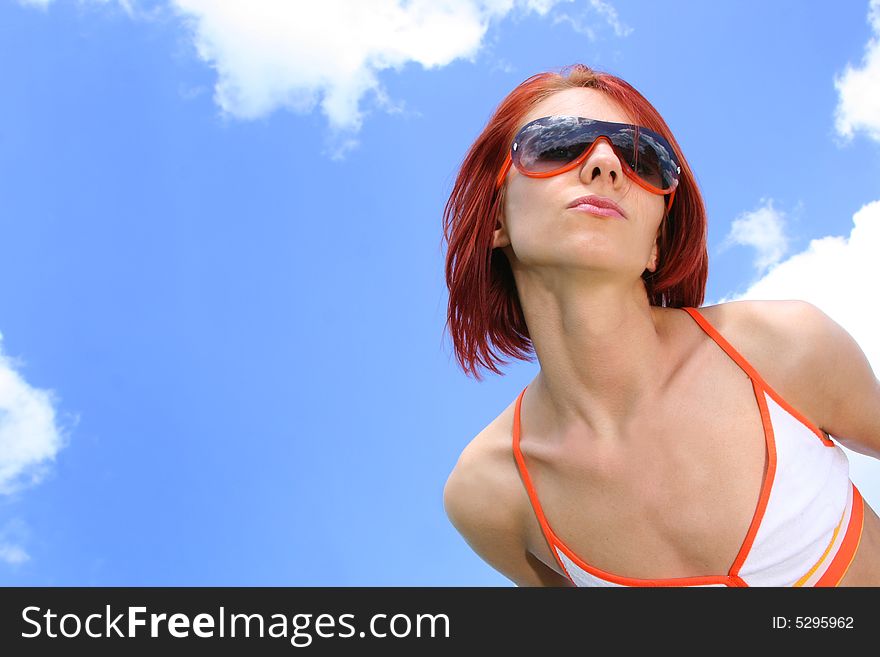 Young redhead girl relaxing outdoors. Young redhead girl relaxing outdoors