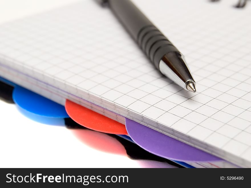 Diary and pen on a white background