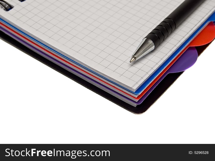 Diary and pen on a white background.