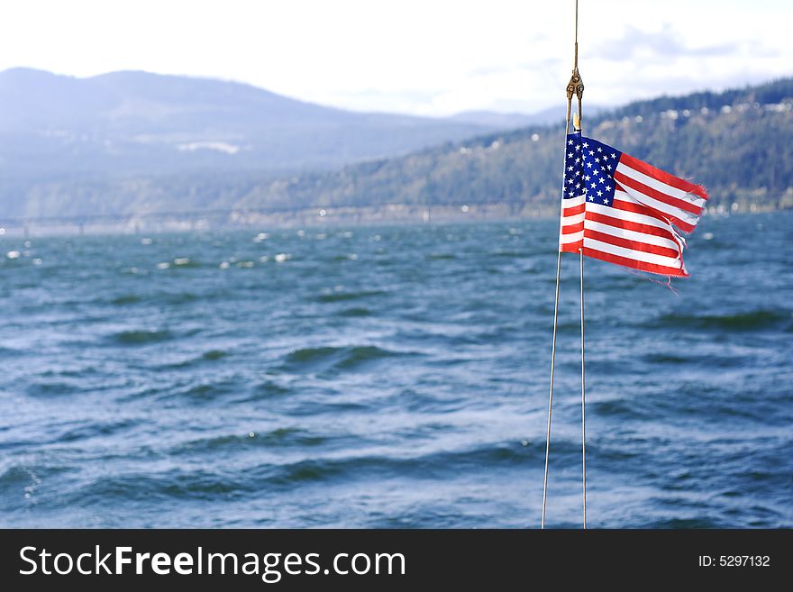 A flag attatched to lines on a sailboat. A flag attatched to lines on a sailboat.