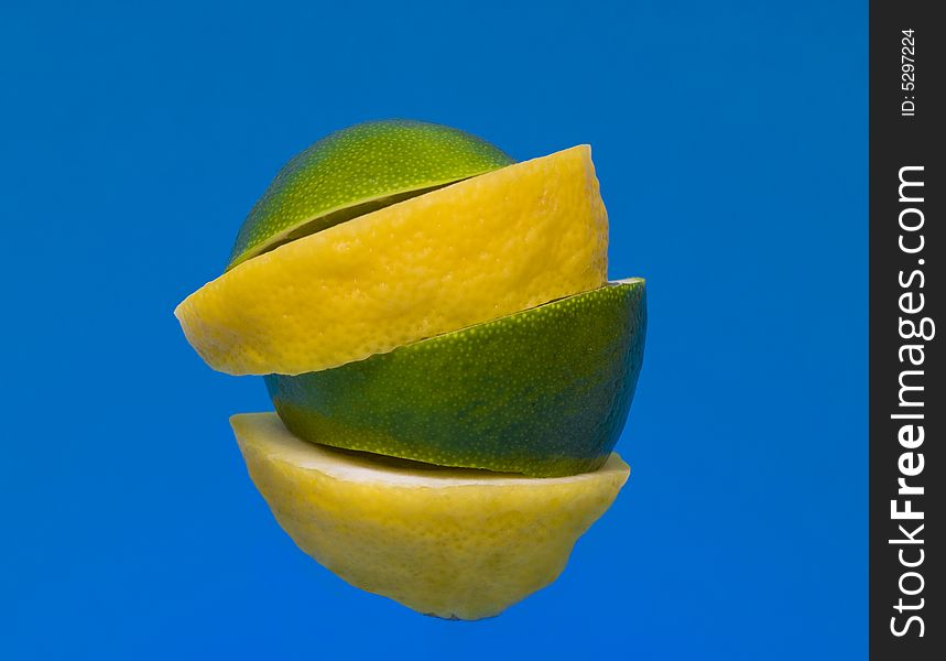 Pieces of lime and lemon stacked together.