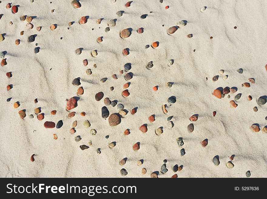 Coloured pebble on beach