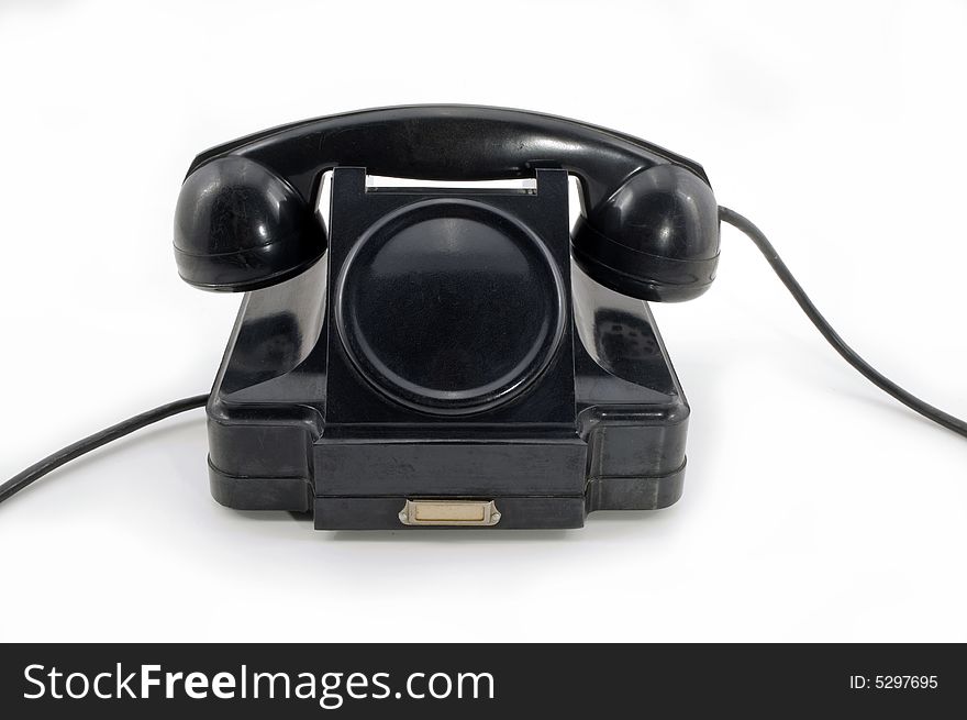 Old-fashioned black telephone receiver with cord on white background. Old-fashioned black telephone receiver with cord on white background.