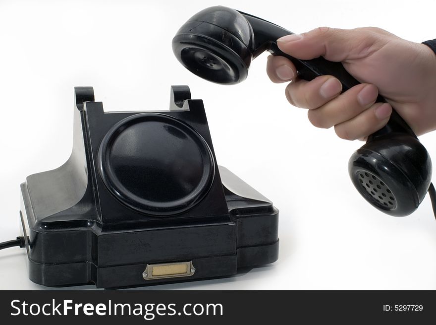 Telephone receiver in hand, isolated on white background. Telephone receiver in hand, isolated on white background.