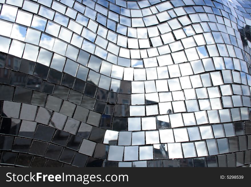 Mosaïc made of little squares of mirrors reflecting the sky. Mosaïc made of little squares of mirrors reflecting the sky.