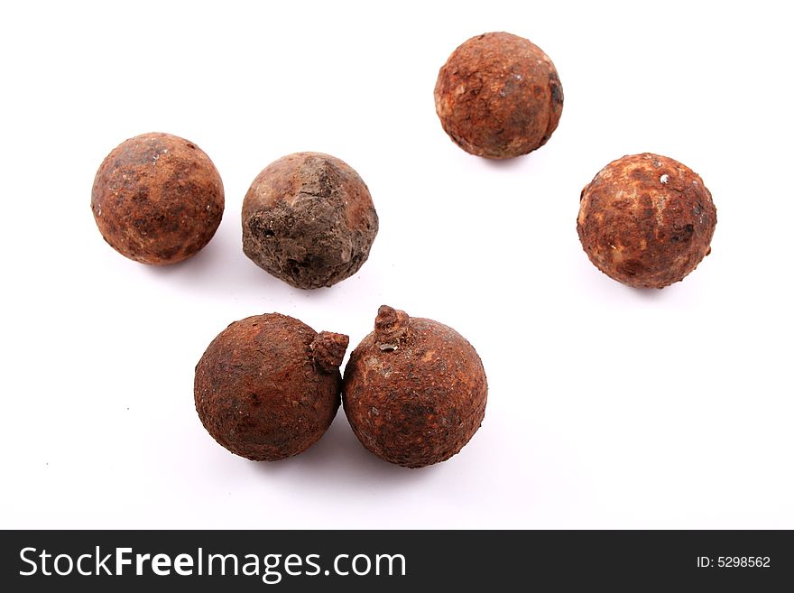 Six rusted balls over white background. Two balls are separated.