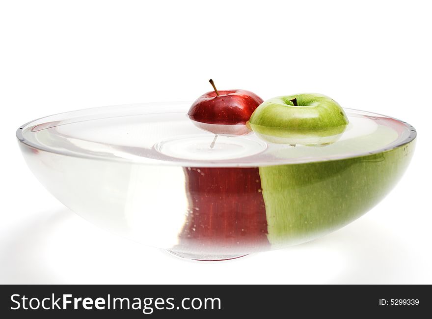 Green and red apples in vase with water -3