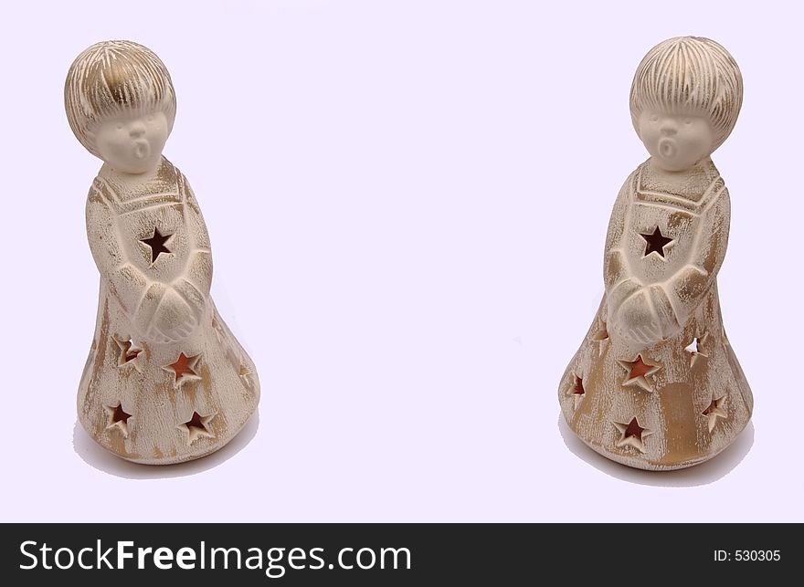 Children statue with a star dress singing in a white background. Children statue with a star dress singing in a white background