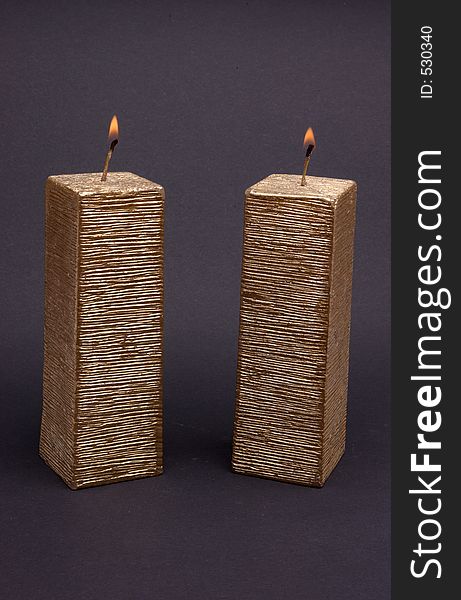 Lighted candles with a dark background