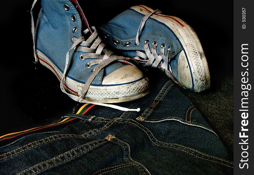 Dirty sneakers, jeans and belt. Dirty sneakers, jeans and belt