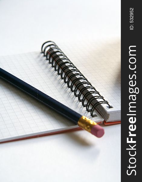Picture of a pencil laying on the diary. Picture of a pencil laying on the diary