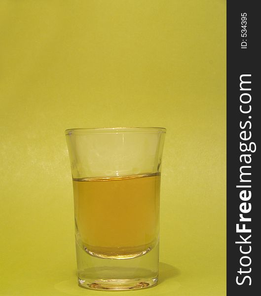 Ounce of rhum on green background. Ounce of rhum on green background