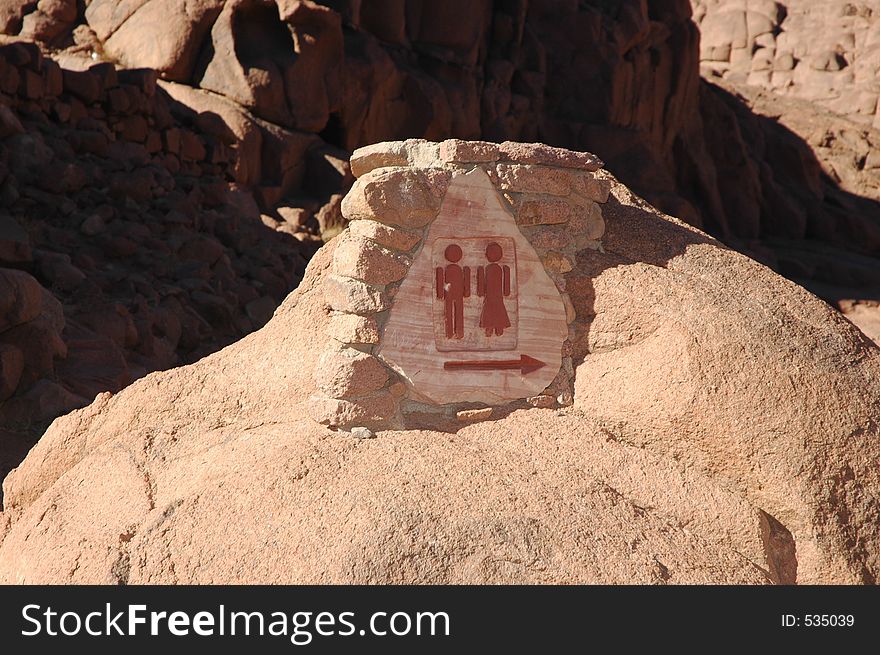 Stone WC sign in the Sinai mountains, Egypt