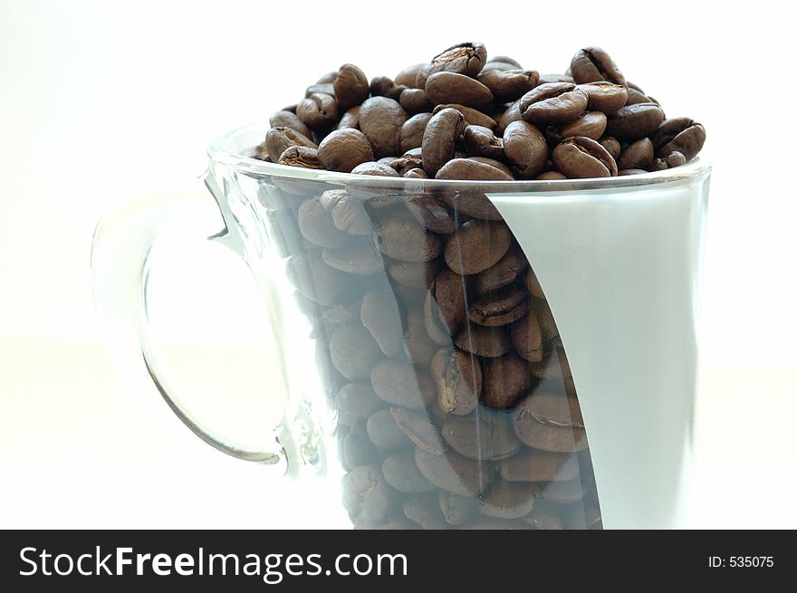 Coffee beans in a cup. Coffee beans in a cup