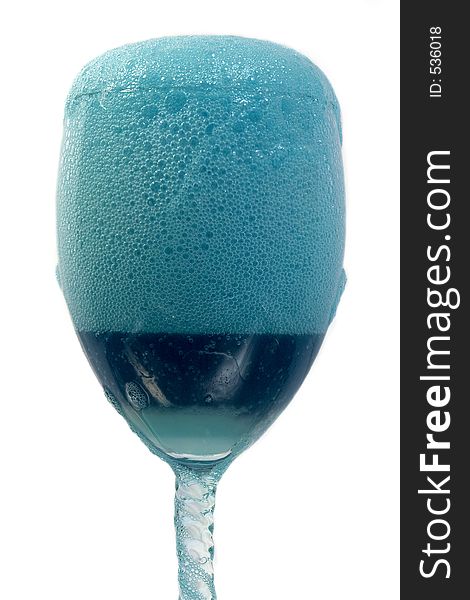 A blue frothy drink. A blue frothy drink