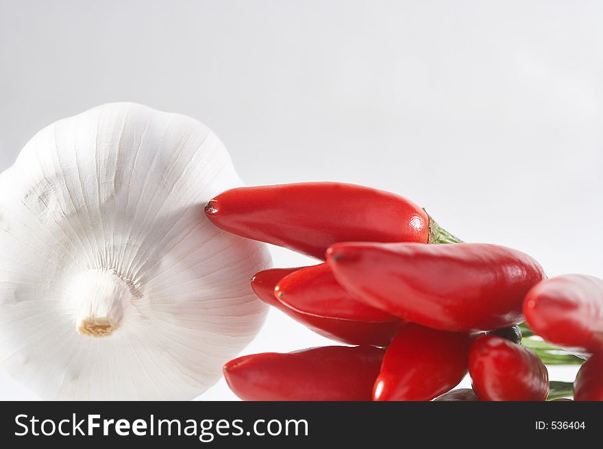 Garlic clove and red chilli - Knoblauchknolle und rote Chilli. Garlic clove and red chilli - Knoblauchknolle und rote Chilli