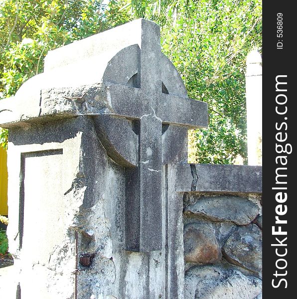 Old concrete gatepost in the form of a crucifix. Old concrete gatepost in the form of a crucifix