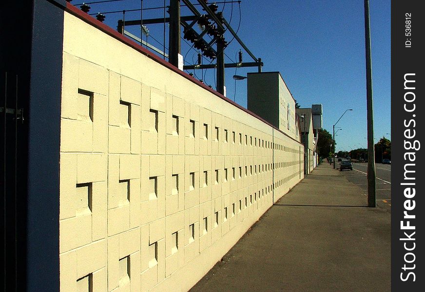 Linear perspective view along a sunlit wall. Linear perspective view along a sunlit wall