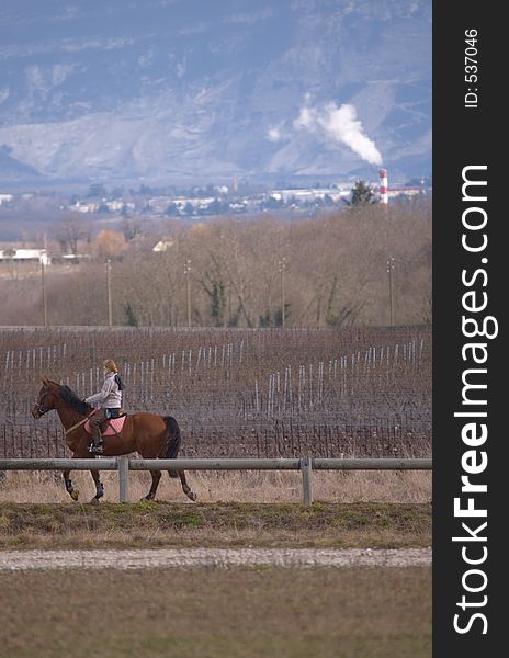 Lonely woman on a horse in the country near geneva. Lonely woman on a horse in the country near geneva