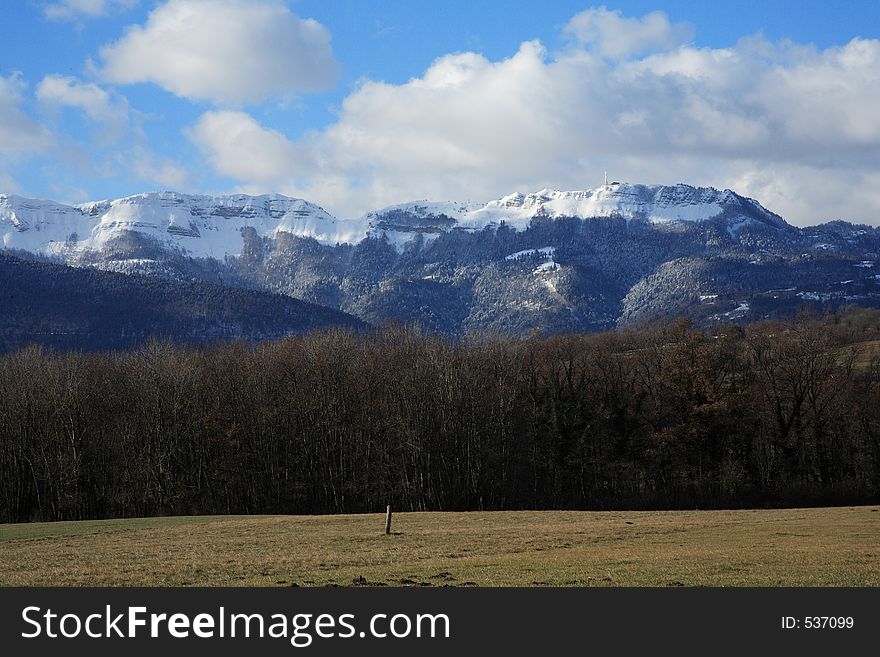 Snow is on the cliff situated in france near Geneva. Snow is on the cliff situated in france near Geneva