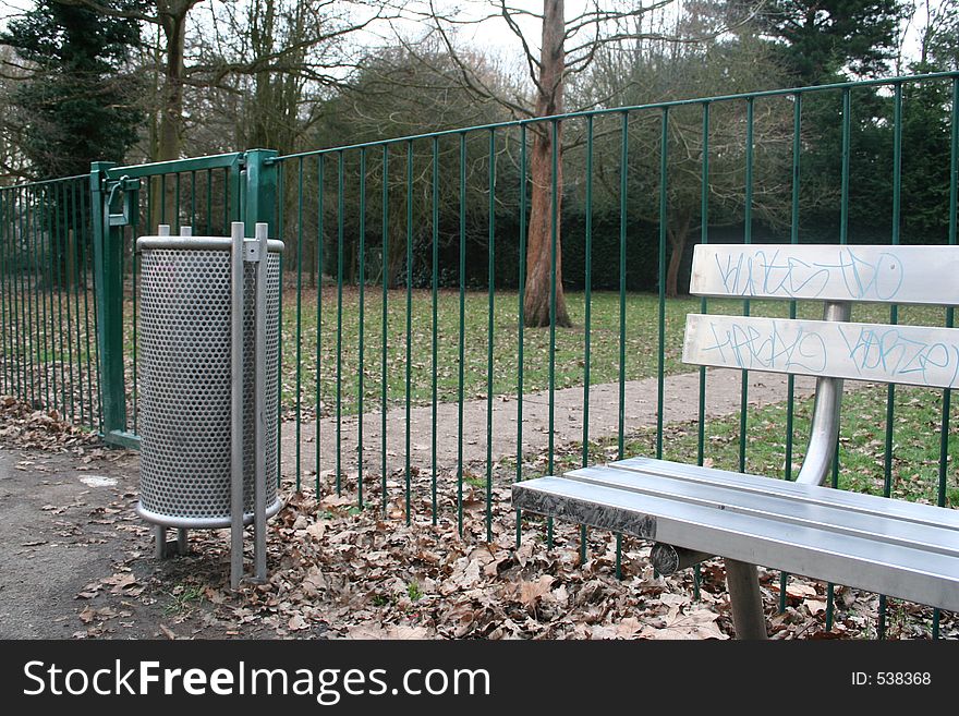 Silver bench in bin in playground. Silver bench in bin in playground