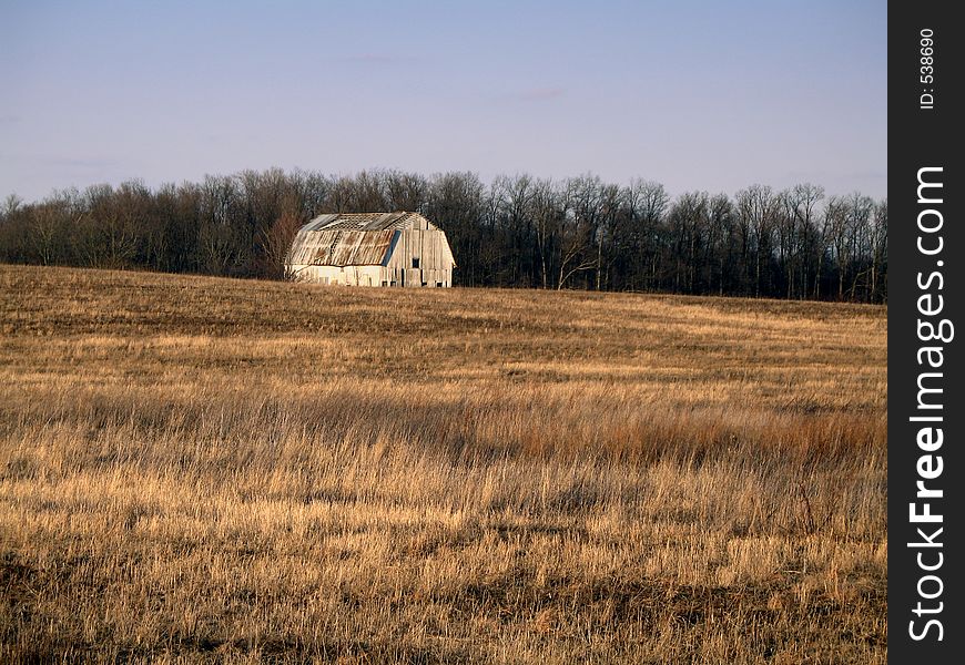 White barn in a grass field
