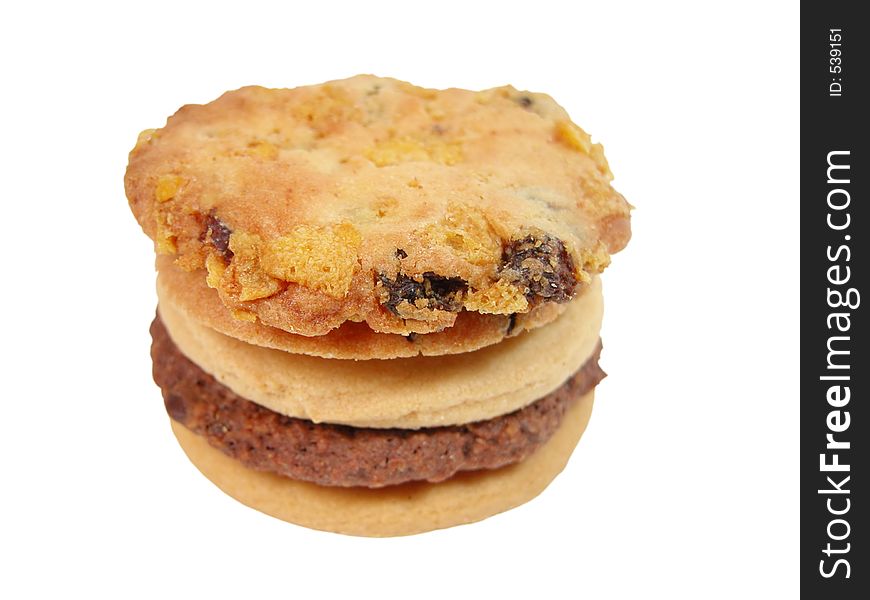 Stack of biscuits isolated over white background with clipping path.Selective focus on the margin of the top biscuit. Stack of biscuits isolated over white background with clipping path.Selective focus on the margin of the top biscuit.