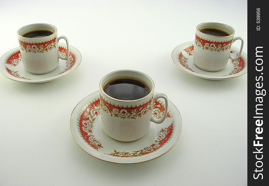 Three coffee cups on a white background