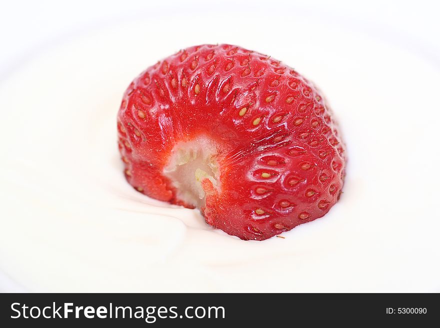 Ripe strawberry with sour cream