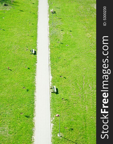 Emptz footpath with green grass from above