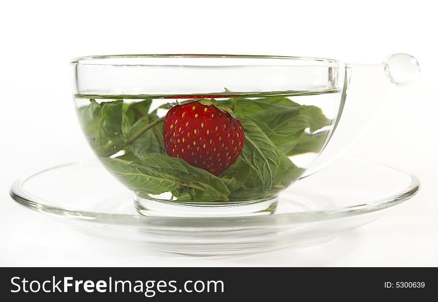 Herbal tea with mint and a strawberry. Herbal tea with mint and a strawberry