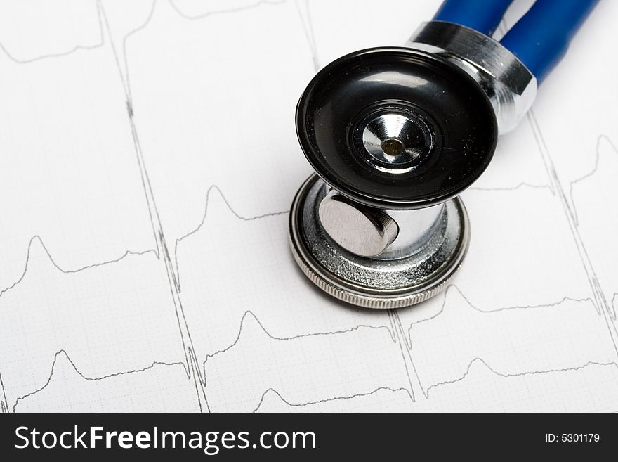 Stethoscope on electrocardiogram chart. Medical concept for cardiology.