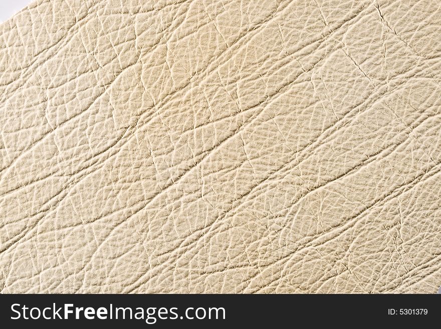 Natural qualitative beige leather texture. Close up. Natural qualitative beige leather texture. Close up.