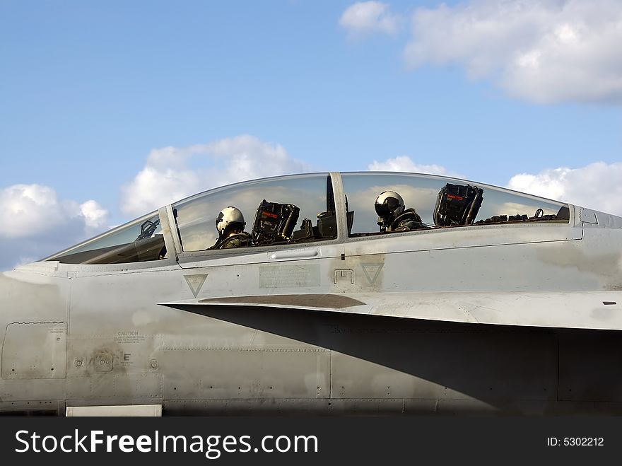 Two Naval aviators in the cockpit of their F-18 Super Hornet. Two Naval aviators in the cockpit of their F-18 Super Hornet