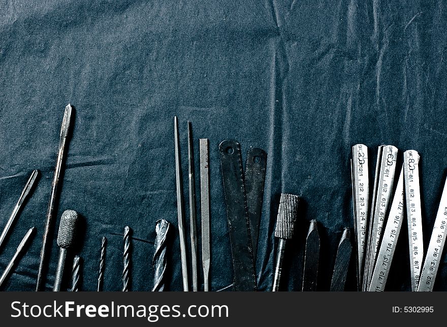 Grunge tools on black background