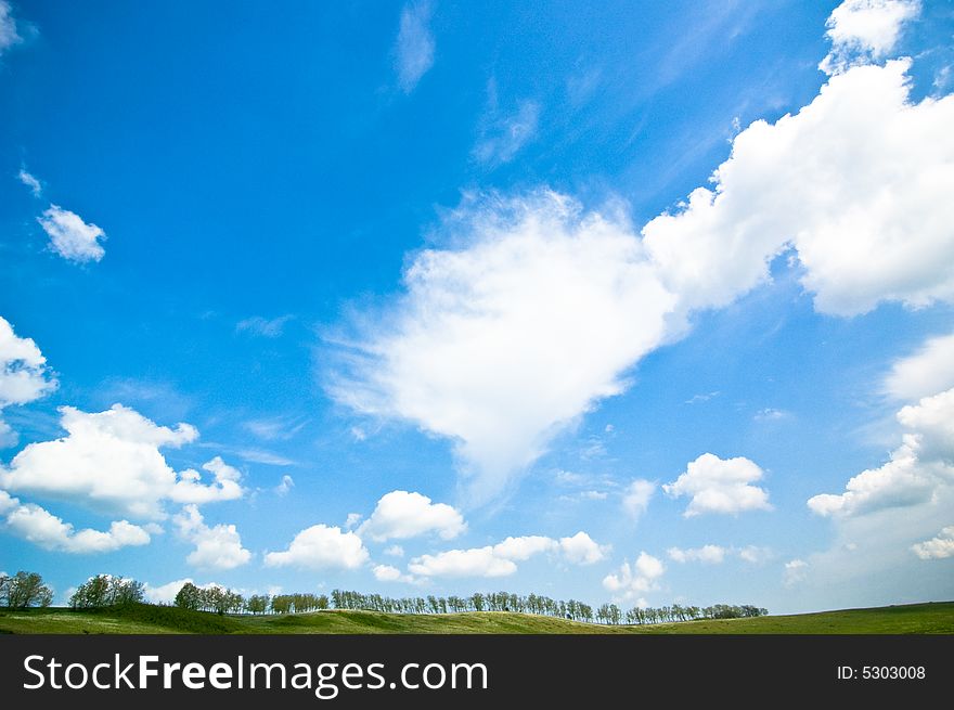 Summer landscape with marvellouswhite clouds