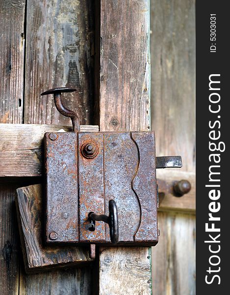 Old door lock at a wooden door