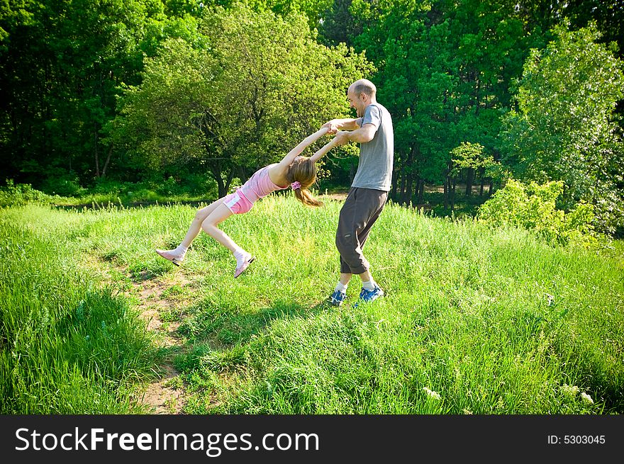 Father and daughter playing outdoors