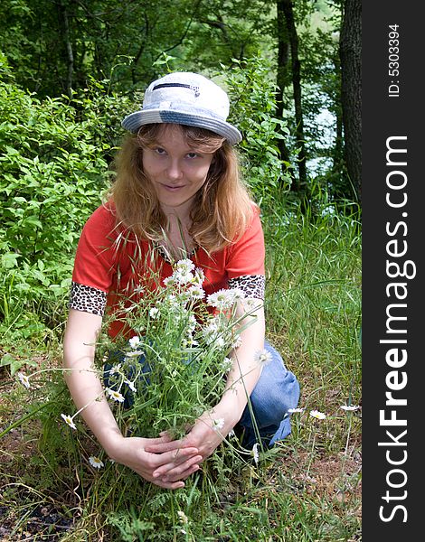 The young girl with camomiles