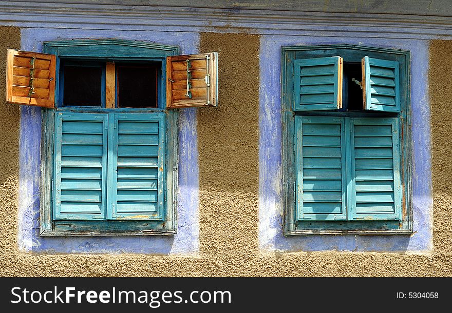 Old windows on stone house