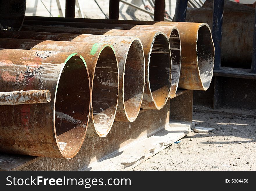 Rusty pipes on a construction site just waiting