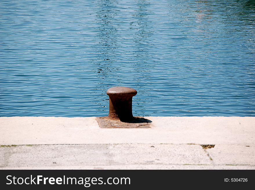 Clear still waters on the pier's edge