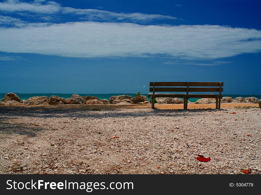 A bench overlooking the water of the Caribbean. A bench overlooking the water of the Caribbean