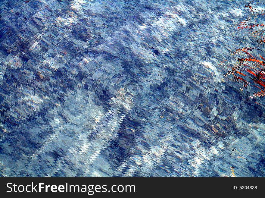 Very textured and wavy blue liquid with grass floating on the surface.