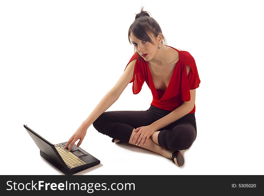 Young girl in red clothes sitting with notebook