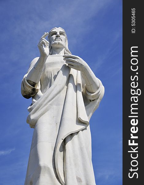 Detail of Jesus Christ statue in Havana against blue sky