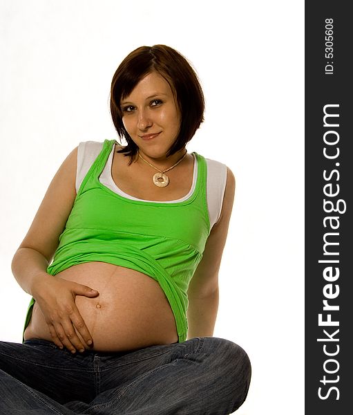 Pregnant woman in green on white